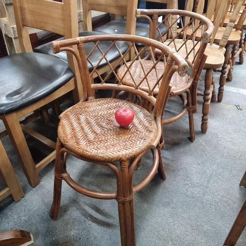 1007 - Two vintage bentwood chair with a hand-woven rattan seat, ideal for adding rustic charm to any room.