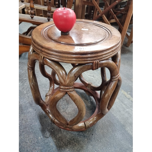 1016 - Ornate vintage Chinese wooden stool, expertly crafted with curvaceous supports and a rich, inviting ... 