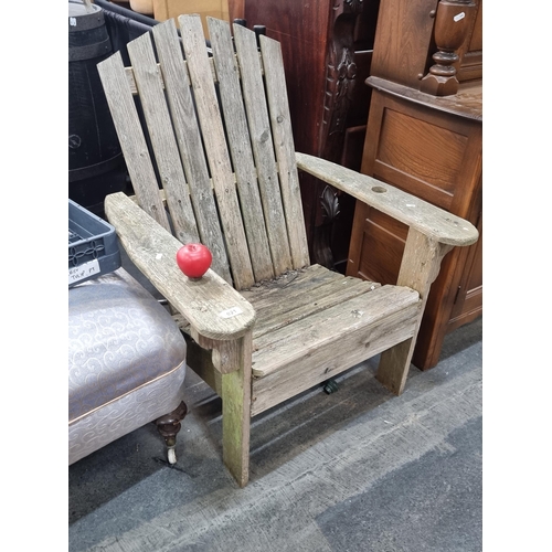 1021 - Rustic wooden Adirondack chair, a charming relic of pastoral comfort, perfect for garden or patio us... 