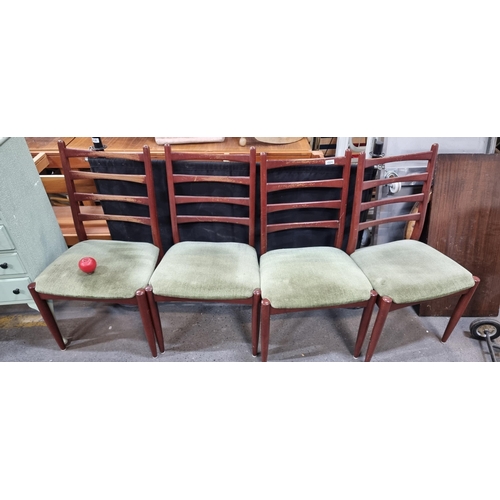 1024 - Four mid century dining chairs with green fabric seats, evoking mid-century charm. Starting at €2