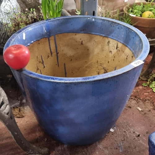 939 - A very large cobalt-blue glazed ceramic planter, adding a splash of color to your outdoor space.