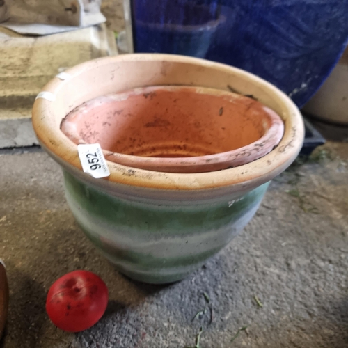 952 - Two terracotta planters, one in a fab multicolored glaze, suitable for outdoor décor.