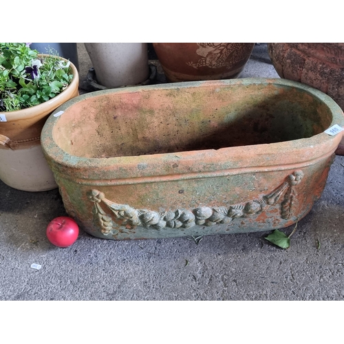 960 - A lovely vintage terracotta trough planter, adorned with a garland motifs.