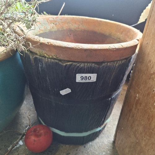 980 - A terracotta planter in a hard wearing plastic container in the form of a slatted wooden bucket. (2)