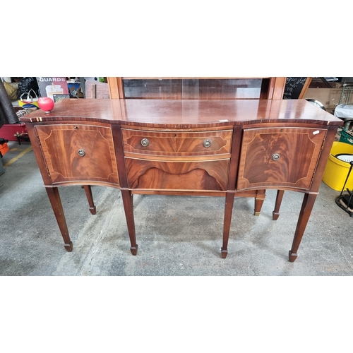 997 - Star Lot : An elegant antique Edwardian mahogany sideboard, boasting a serpentine front, featuring c... 