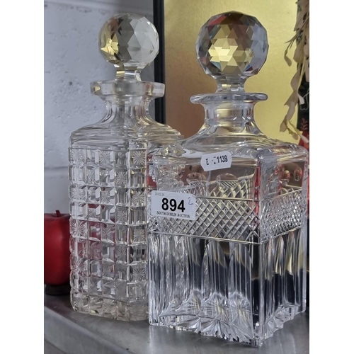 894 - Two fabulous decanters both include stoppers. Including one stunning cut crystal example with slice ... 