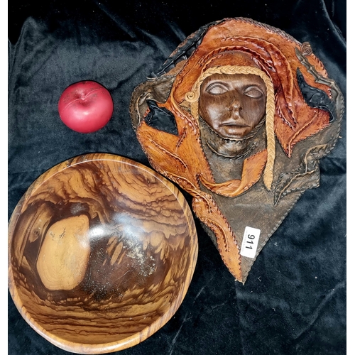 911 - An unusual molded leather wall hanging mask and a heavy African wood turned bowl.