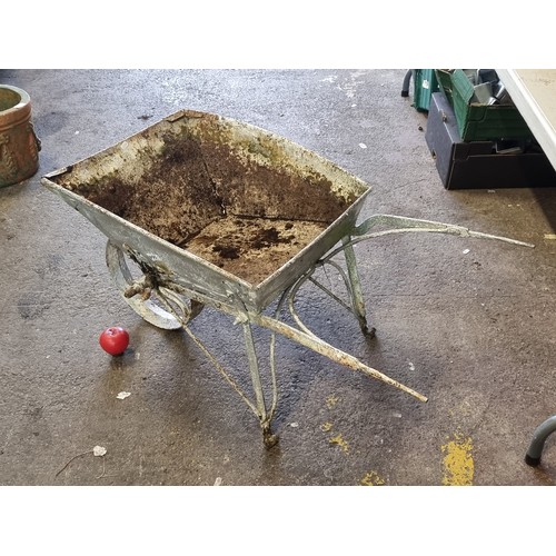 995 - A delightful cast metal wheelbarrow, in a shiny silver painted finish. Would look lovely filled with... 