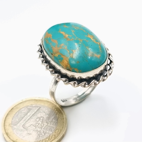 1033 - A very attractive 925 Silver oval turquoise decorated ring. Size S. Weight of ring is 8.83 grams. Go... 