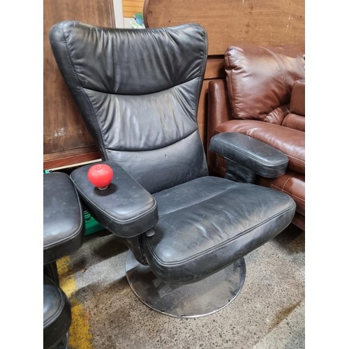 Star Lot : A super stylish soft black Italian leather high wing recliner chair with armrests, chrome base. Bought from Bushell Interiors. Same chair although this one doest have a footstool.