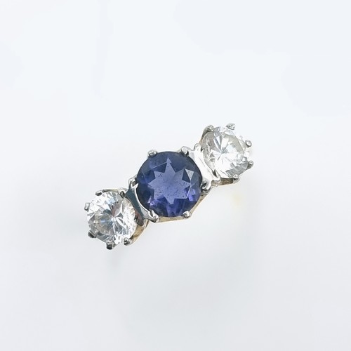 34 - A very pretty three stone Tamnzanite and gemstone ring. Size - O and a half. Weight is 2.7 grams.