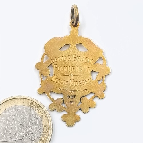 517 - Star Lot : A nine carat gold medal given for senior grade piano 1934 Dublin, forte to a Nelli nujent... 