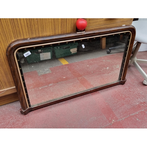 368 - An antique Overmantle mirror, adorned with gilt inlay, exudes period elegance and charm.