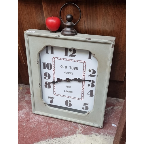 379 - A contemporary large style Old Town London wall clock, wooden frame with glass, charmingly distresse... 