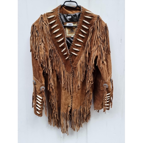 382 - A very cool vintage suede leather jacket with detailed bone beadwork and fringe accents, embracing a... 