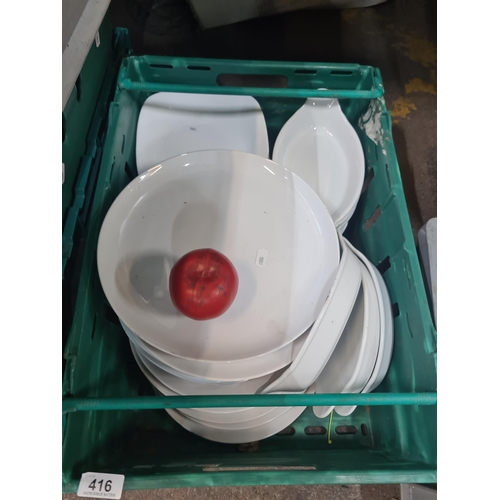 416 - An assortment of white plates and dishes by brands such as Royal Gen Ware. Includes dinner plates, s... 