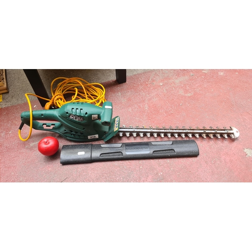 419 - An electric Parkside hedge trimmer with protective blade cover. Model No: PHS450A1. Getting to that ... 