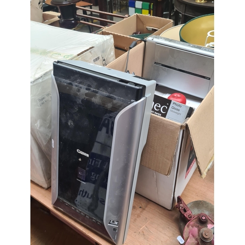 430 - A box containing a Canon canoscan 9000F scanner along with a Canon IP100 photograph printer. Comes w... 