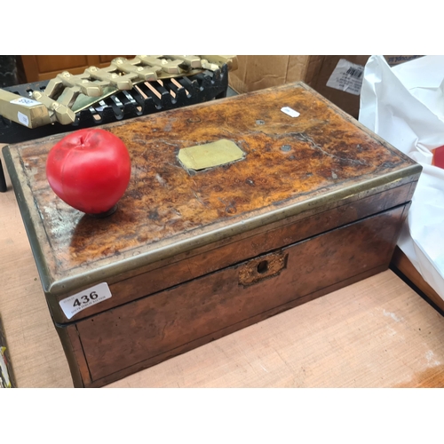 436 - An antique burr walnut writing slope featuring brass accents, rich patina, 19th-century charm, brass... 