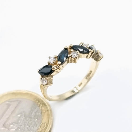 65 - Star Lot : A fabulous example of a nine carat gold four stone sapphire ring set with diamonds. Ring ... 