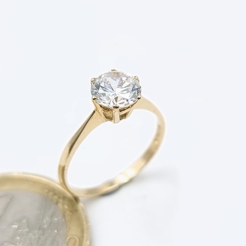 66 - A nine carat gold solitaire stone ring set with a large clear Zirconia. Ring size - L. Weight - 1.46... 