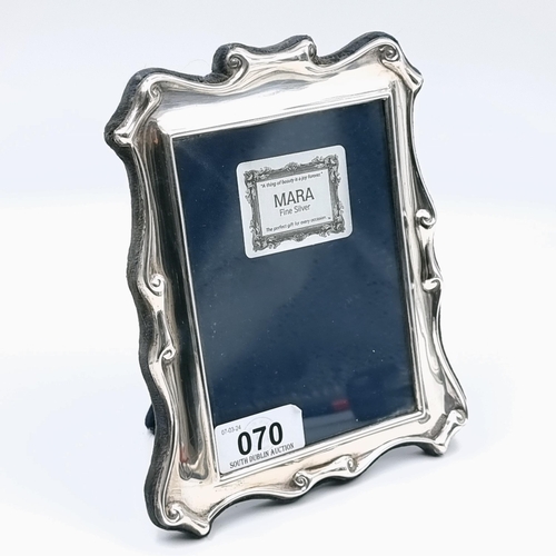 70 - A glazed sterling silver photo frame by Carrs of Sheffield. Internal dimensions: Height 13.5 cms, Wi... 