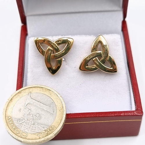 74 - A pair of marked stud Celtic earrings probably nine carat gold. Weight - 2.8 grams.