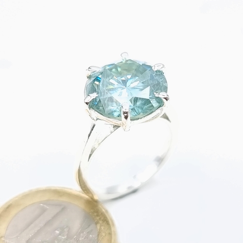 79 - A Beautiful blue moissanite stone ring of 5.4 carats set in sterling silver. Size - O. Weight - 5.56... 