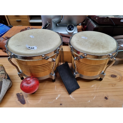 448 - A lovely set of bongo drums with chrome and calf skin construction.