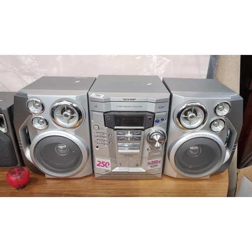 An excellent Sharp mini component system model no: CD-E700. Two