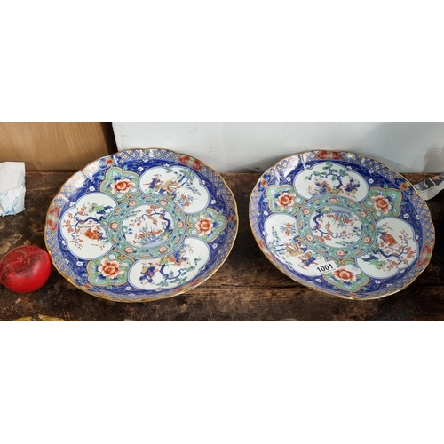 1001 - Star Lot : An elegant pair of vintage porcelain larger heavy chargers, exquisitely hand-painted with... 