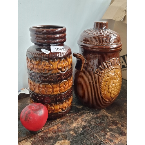 1002 - Two Rustic ceramic jars, Inc an West German Mide century striped vase and the other boasting a grape... 