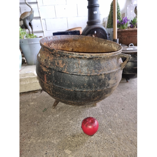 981 - A vintage cast iron cauldron, rich patina with three-legged support. Would look wonderful filled wit... 