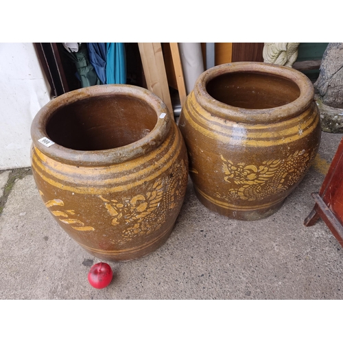 988 - Star Lot : A stunning large pair of very large pottery planters, finished with a brown glaze. These ... 