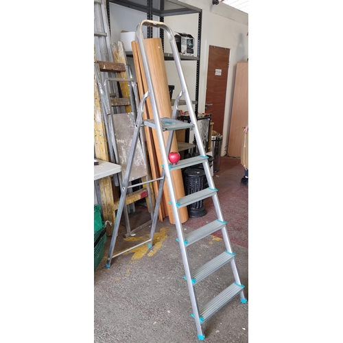 994 - An aluminum step ladder, ideal for both home and workspace.