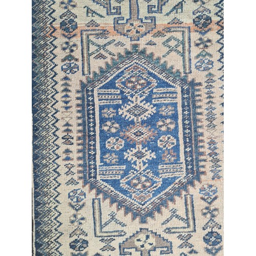 377 - Star Lot : A vintage hand made Persian rug, showcasing traditional patterns and a rich color palette... 