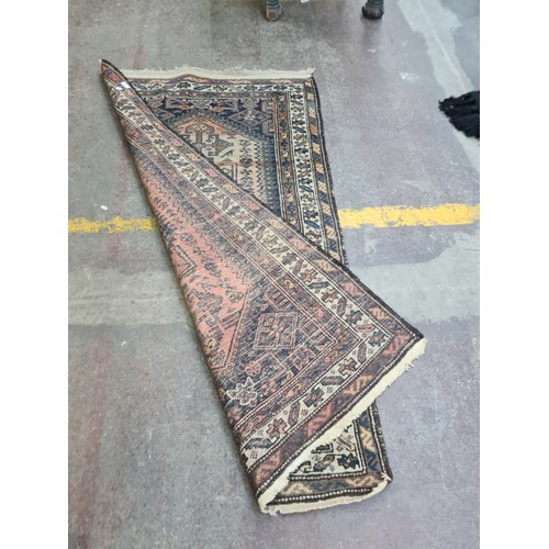 377 - Star Lot : A vintage hand made Persian rug, showcasing traditional patterns and a rich color palette... 