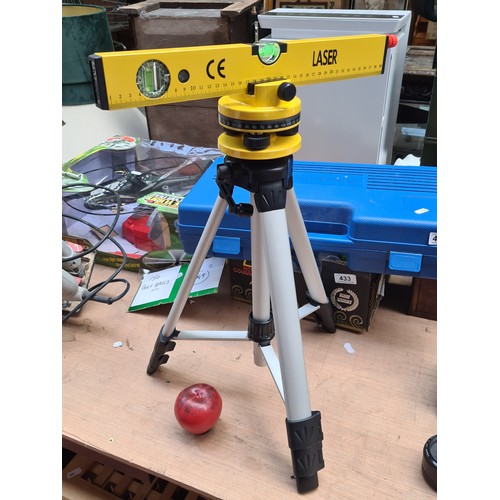 434 - A high quality Parkside laser spirit level with tripod. Complete in hard shell carrier case.