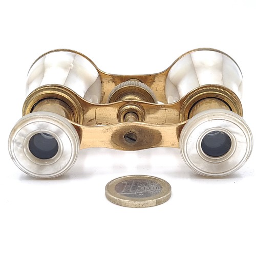 38 - A lovely pair of antique Opera glasses set with brass fittings with Mother of Pearl detailing. Enclo... 