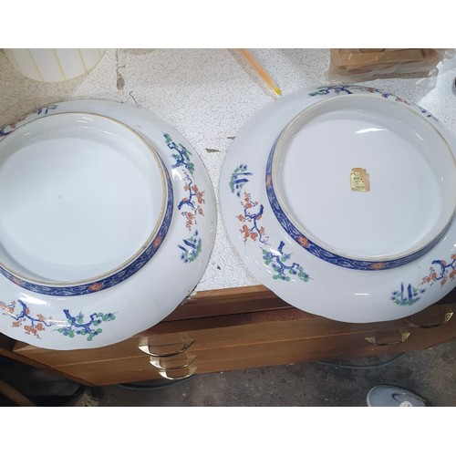 1001 - Star Lot : An elegant pair of vintage porcelain larger heavy chargers, exquisitely hand-painted with... 