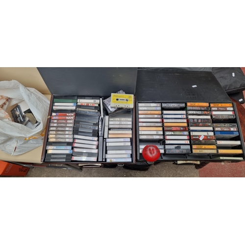 404 - A selection of vintage cassette tapes including artists such as  Stevie Wonder. Held in two vintage ... 