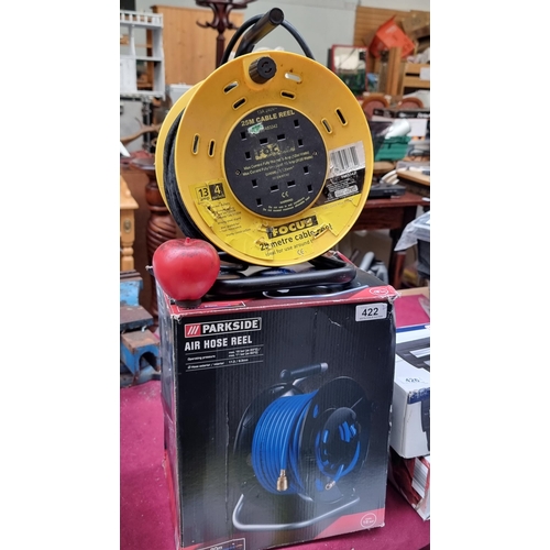 422 - A new in box Parkside air hose reel along with a Focus 25Ltr cable reel.