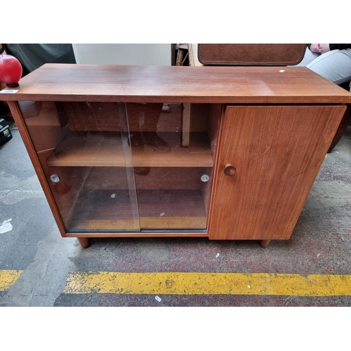 A super cool mid century Teak glass fronted display cabinet.