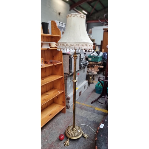 588 - Star Lot : A striking Early 20th century very heavy brass floor standing lamp with three claw feet w... 