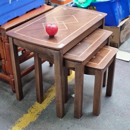 592 - A beautiful set of three vintage nesting tables boasting fabulous marquetry detail to top.