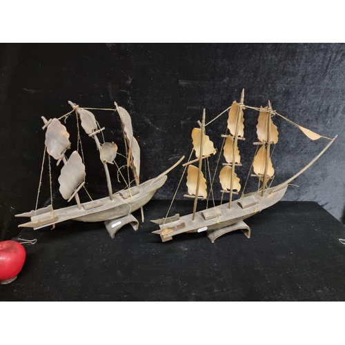 242 - A pair of very cool vintage horn sculptures in the form of sail boats featuring lovey carved wave  d... 