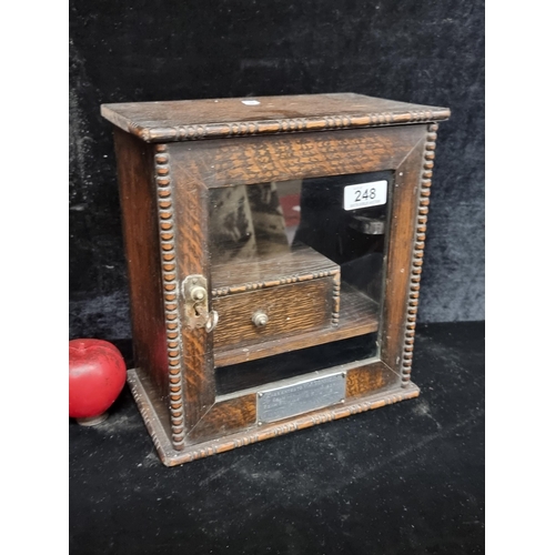 248 - A handsome antique wooden smokers cabinet includes presentation plaque inscribed 'Presented to W. J.... 