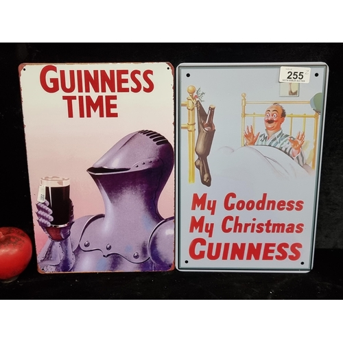 255 - Two printed metal wall signs advertising Guinness.