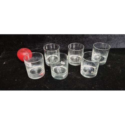 276 - A set of six hand blown whiskey glasses with heavy bases with rough pontil marks. Slight variation t... 