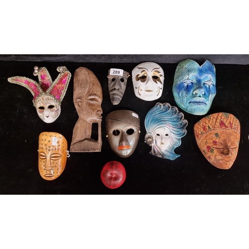 289 - A collection of eight vintage masks including metal, carved wood and porcelain examples. Also includ... 